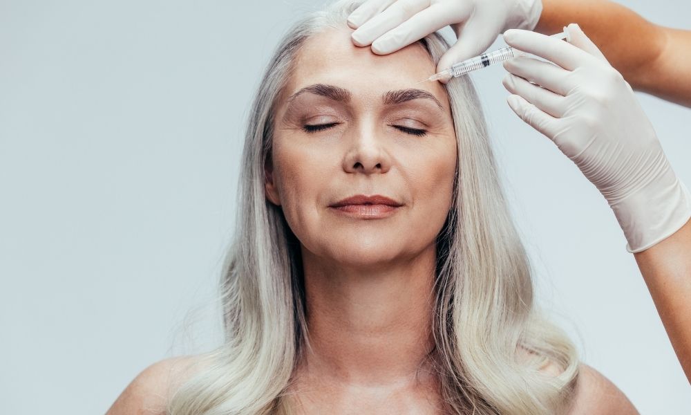 Middle Aged female receiving botox or injectible fillers